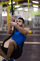 Image showing man doing rope climbing