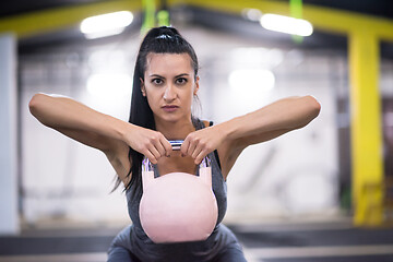 Image showing woman exercise with fitness kettlebell