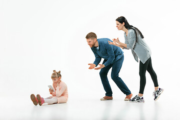 Image showing Angry parents scolding their daughter at home