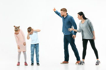 Image showing Angry parents scolding their children at home