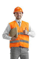 Image showing The builder in orange helmet isolated on white