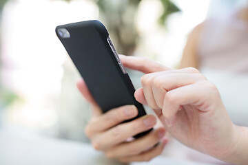 Image showing Woman sending sms on phone