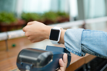 Image showing Customer using wearable watch to pay