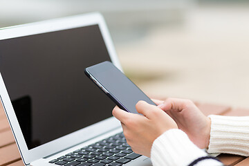 Image showing Woman use of cellphone and laptop computer