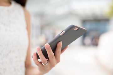 Image showing Woman sending message on phone