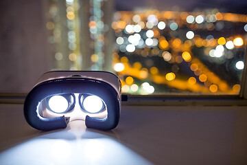 Image showing VR device with cityscape background