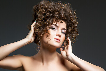 Image showing beautiful girl with curly hairdo