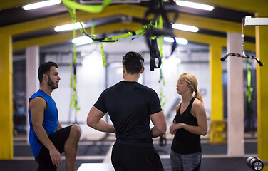 Image showing athletes working out  jumping on fit box