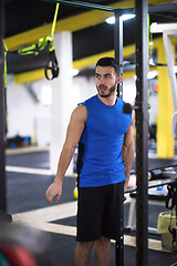 Image showing man doing pull ups on the vertical bar