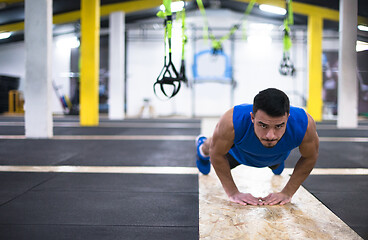 Image showing Young  man doing pushups