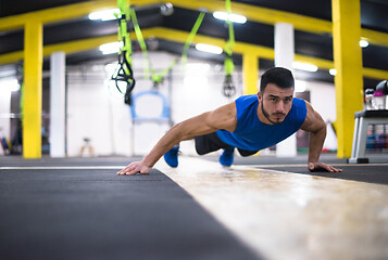 Image showing Young  man doing pushups