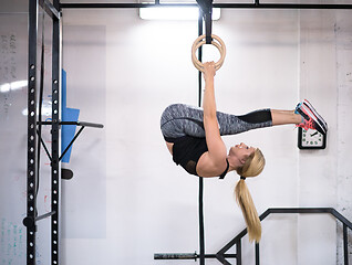 Image showing woman working out on gymnastic rings