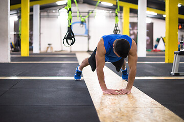 Image showing Young  man doing pushups