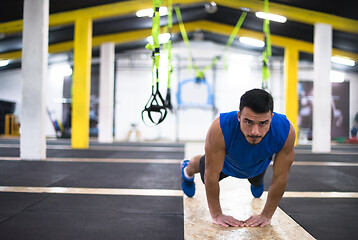 Image showing Young  man doing pushups