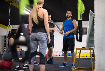 Image showing athletes getting instructions from trainer