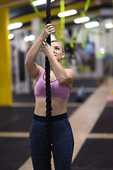 Image showing woman doing rope climbing