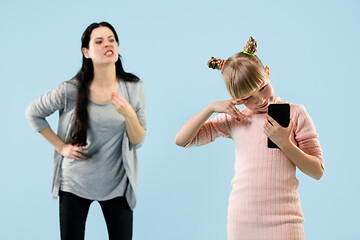 Image showing Angry mother scolding her daughter at home