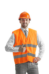 Image showing The builder in orange helmet isolated on white