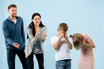 Image showing Angry parents scolding their children at home