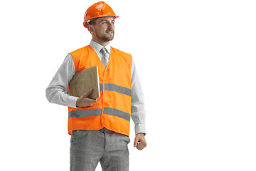 Image showing The builder in orange helmet isolated on white