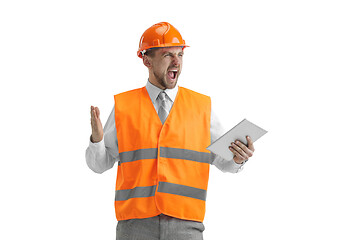 Image showing The builder in orange helmet isolated on white