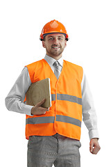 Image showing The builder in orange helmet isolated on white