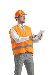 Image showing The builder in orange helmet isolated on white