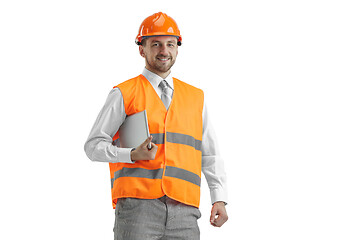 Image showing The builder in orange helmet isolated on white