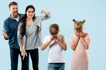 Image showing Angry parents scolding their children at home