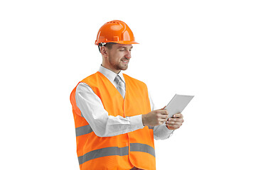 Image showing The builder in orange helmet isolated on white