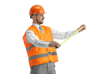 Image showing The builder in orange helmet isolated on white