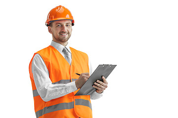 Image showing The builder in orange helmet isolated on white