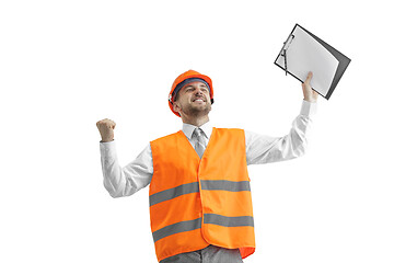 Image showing The builder in orange helmet isolated on white