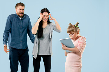 Image showing Angry parents scolding their daughter at home