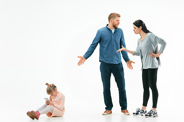 Image showing Angry parents scolding their daughter at home