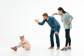 Image showing Angry parents scolding their daughter at home