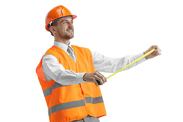 Image showing The builder in orange helmet isolated on white