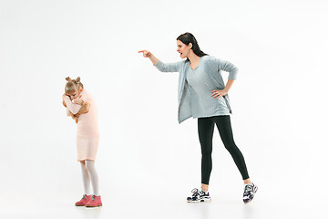 Image showing Angry mother scolding her daughter at home
