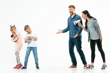 Image showing Angry parents scolding their children at home