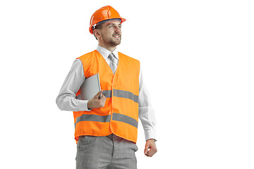 Image showing The builder in orange helmet isolated on white