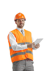 Image showing The builder in orange helmet isolated on white