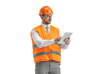 Image showing The builder in orange helmet isolated on white