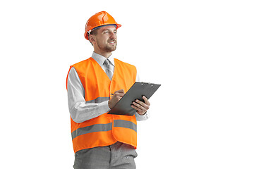 Image showing The builder in orange helmet isolated on white