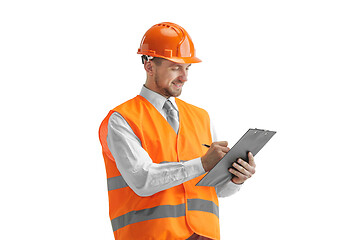 Image showing The builder in orange helmet isolated on white