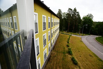 Image showing facade of a three-story dwelling house 