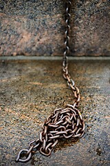 Image showing old rusty cast iron chain on granite 