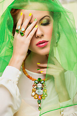 Image showing beautiful girl in green veil