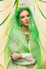 Image showing beautiful girl in green veil