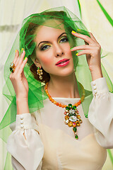 Image showing beautiful girl in green veil