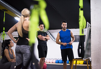 Image showing athletes getting instructions from trainer